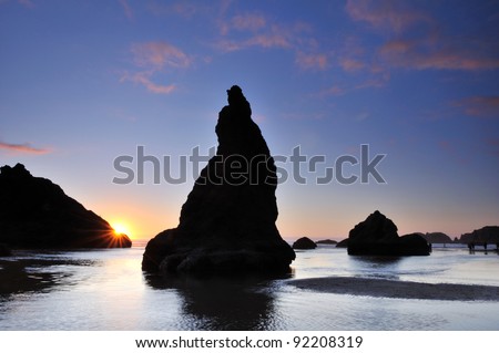 sunset with rock formations at bandon beach in Oregon,  pacific northwest usa