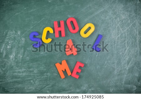 School for me-   Writen with colored letters on a  blackboard.