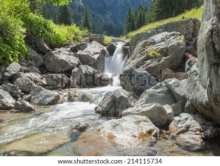 Picture of a little waterfall in the austrian mountain. Picture is toned.