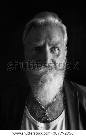 Black and White Portrait of a beard man with a long white beard.