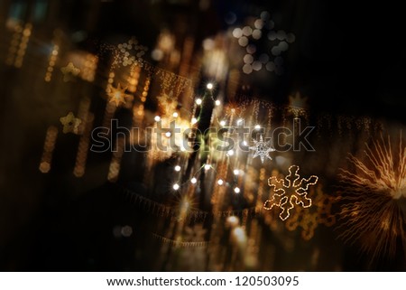 Layered star background of star shaped street lights, star garlands, different star shapes and star bokeh in a depth of field composition