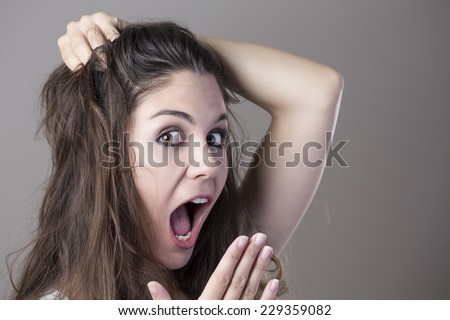 Portrait of a young brunette woman making faces with different expressions and emotions
