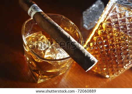 whiskey and cigar on wooden counter