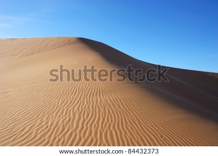 Desert in Hasi Labied, Moroco, Africa. Interesting colored sand dunes. Popular travel destination.