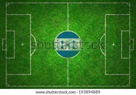 Football pitch with Honduras flag.
