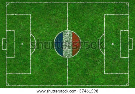 Overhead shot of a football pitch with a French flag in the centre circle