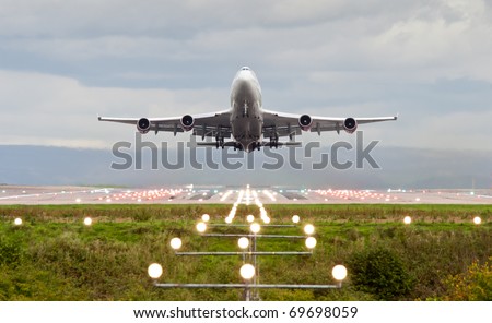 airplane take off at manchester airport england uk airplane take off at manchester airport england uk