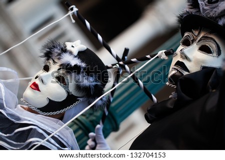 VENICE, ITALY - CIRCA FEB 2010 : Unidentified persons in Venice mask at St. Mark\'s Square, Carnival of Venice circa February 2010. Annual carnival was held in 2010 from February 6 to February 16.