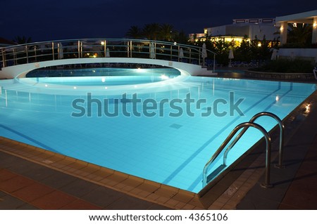 Night illumination in the swimming pool in resort