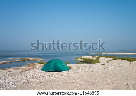 Loneline tent on the sandbank at seaside