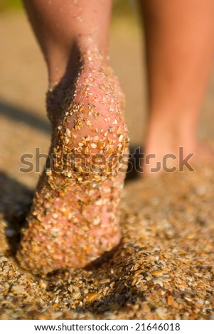 stock photo barefoot girl's feet on sand beach at seaside