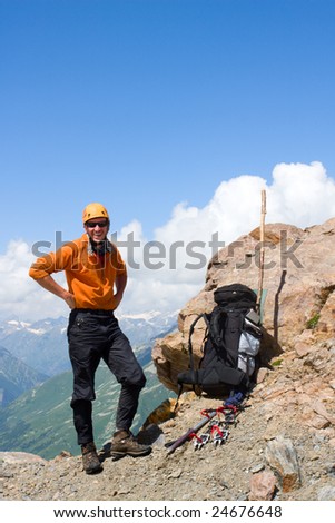 Smiling mountain-climber on the rock