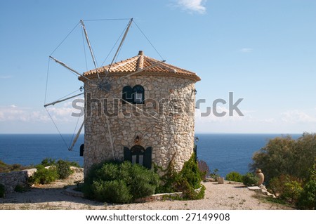 old windmill near of Mediterranean sea on Greece island