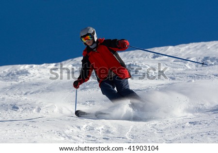 Skier in helmet rush at full speed