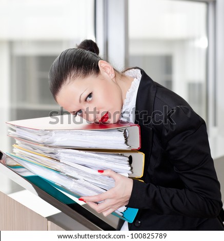Tired secretary with a lot of documents