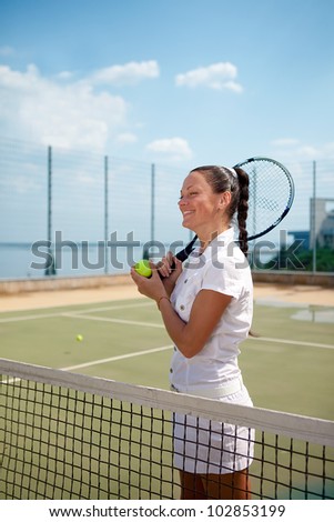 Young woman on a tennis court