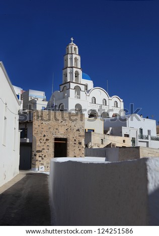 The main church at Pyrgos, Santorini, seen from under an old olive tree.