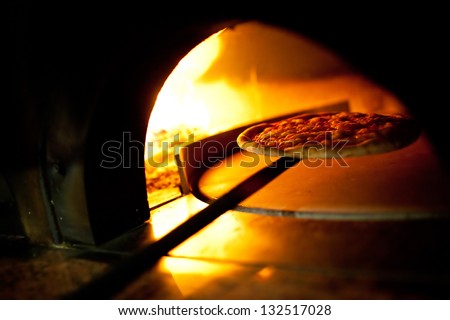 A pizza in a oven burning