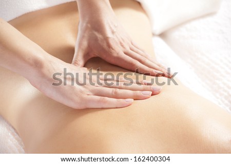Woman Giving Back Massage To A Girl