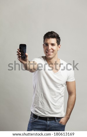 young attractive man taking pictures of him self with phone-selfiy young attractive man taking pictures of him self with phone-selfiy