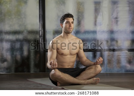 man doing yoga in office