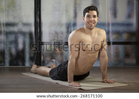 man doing yoga in office