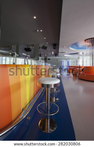 bar stools in futuristic disco club interior