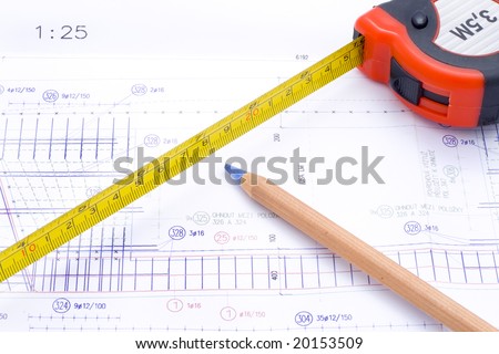 a technical design with a pencil and a measure tape