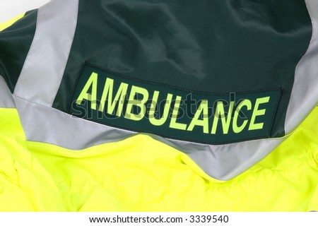 The rear of an Ambulance drivers high visibility jacket
