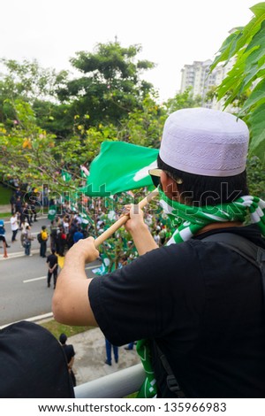 PUTRAJAYA,MALAYSIA-APRIL 20:People show big support to PAS political party candidate during nomination day on April 20,2013 in Putrajaya,Malaysia.The next Malaysian general election on 5 May 2013.