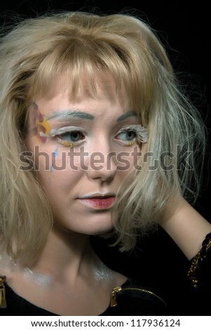 Girl with light hair in a makeup of an angel
