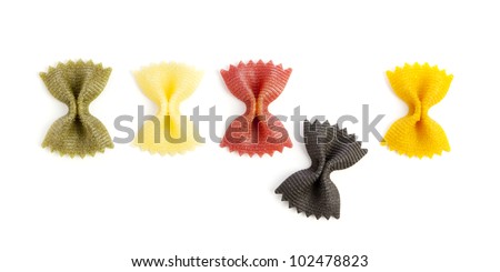 Farfalle Rigate pasta dyed with Basil, Red Chard, Squid Ink and Curcuma, isolated on white