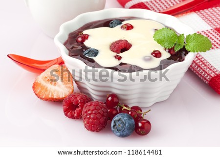 compote of berry fruits with vanilla topping
