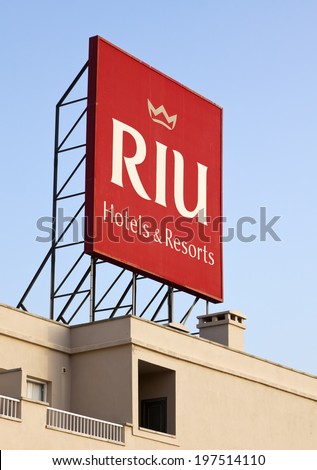 Puerto Rico, Spain - June 26, 2011: RIU Hotels & Resorts logo on billboard on top of RIU Vistamar Hotel. RIU is the 27th largest Hotel chain worldwide.