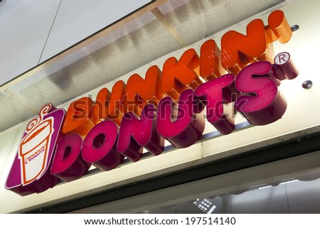 Essen, Germany - September 1, 2011: Dunkin\' Donuts sign at shop entrance. Dunkin\' Donuts is an international doughnut and coffee retailer founded in 1950, headquartered in Canton, Massachusetts.