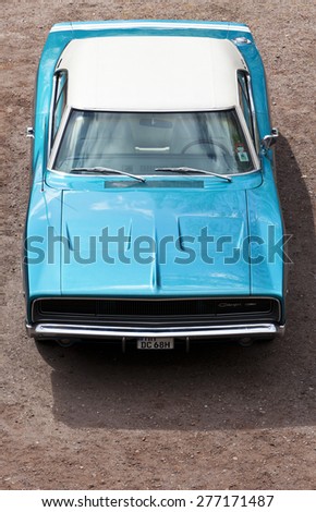 Stade, Germany - May 2, 2015: Sky blue 1968 Dodge Charger with white vinyl top exhibited at MOPAR Spring Fling, annual meeting for vintage automobiles built by Chrysler Corporation