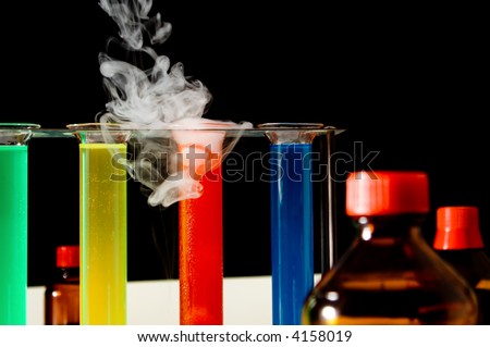 laboratory scene with test tubes, bottles, liquids, smoke