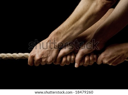 four hands pulling on a rope in one direction