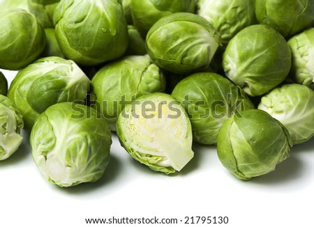 pile of brussels sprouts, halved one in front