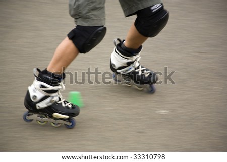 legs of freestyle roller skater, motion blurred