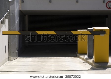 yellow barrier at subterranean car park entrance/exit