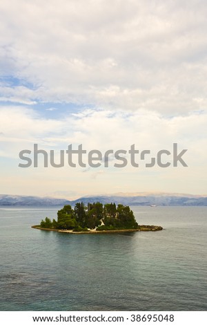 Corfu, greece, Mouse Island Pontikonisi with the mountains of Albania in background