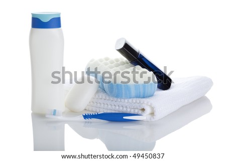 shampoo bottle, soap bar, towel, sponge, toothbrush and after shave isolated on white