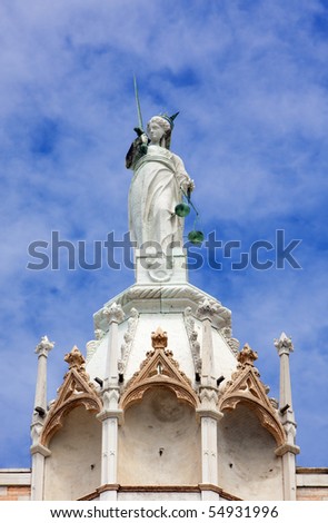 Justitia, goddess of justice on top of the Doge\'s palace at Venice, Italy
