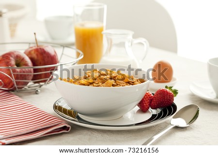 healthy breakfast with cereal flakes, apples, orange juice