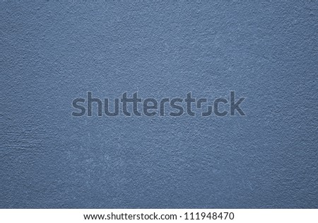 Surface of the concrete wall painted blue.