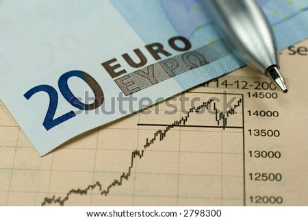 20 Euro banknote with pen and rising stock chart