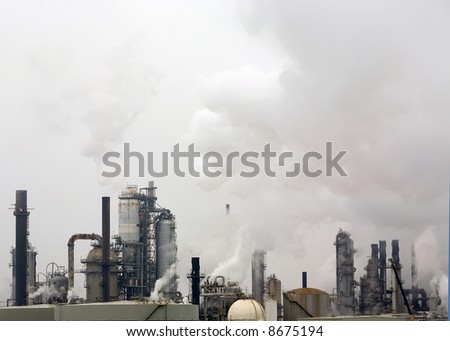 View of a refinery emitting smoke into the environment