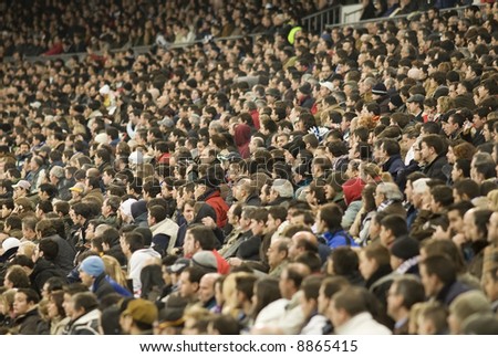 Crowd of people watching a football match