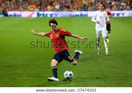 MADRID - MAR 28: Spain\'s David Silva crosses the ball during the second half of their 1-0 victory over Turkey in their World Cup Qualifier March 28, 2009 in Madrid, Spain.